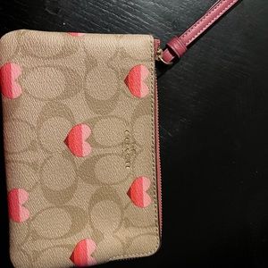 Coach wristlet, brand new, with hearts. . Great gift for valentines.
